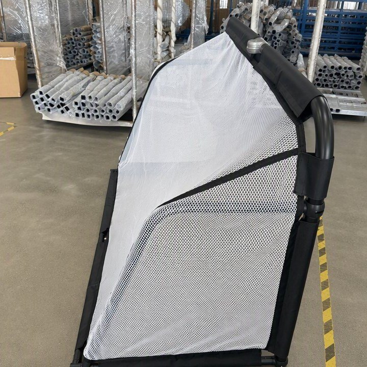 Worker assembling and inspecting a rebound net in the factory